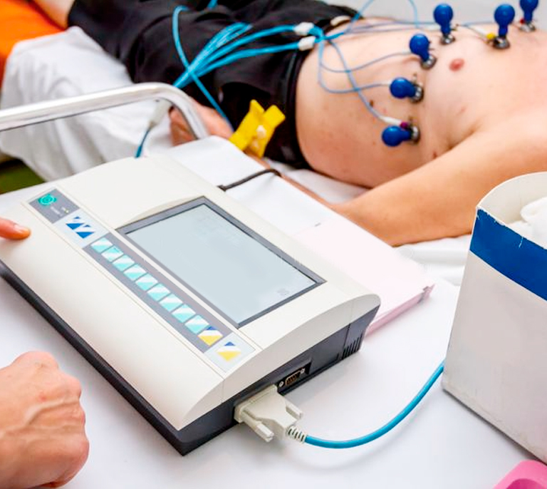 Electrocardiogram ECG machine showing heart activity used at Medical Center Playa del Inglés in Gran Canaria for cardiac testing and diagnosis.