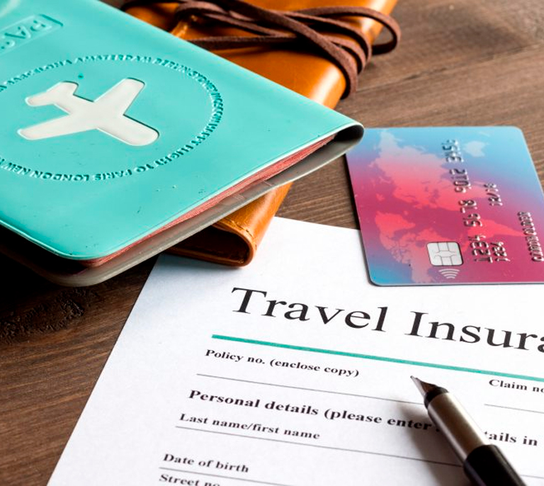 Travel insurance documents, passport, and card used for medical coverage at Medical Center Playa del Inglés, Gran Canaria.